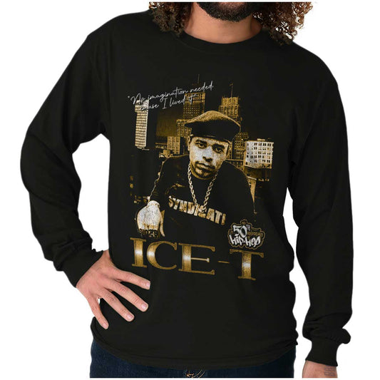The image shows a confident ICE-T wearing chains in front of city skyscrapers, representing the bold and resilient essence of hip-hop and its legacy.
