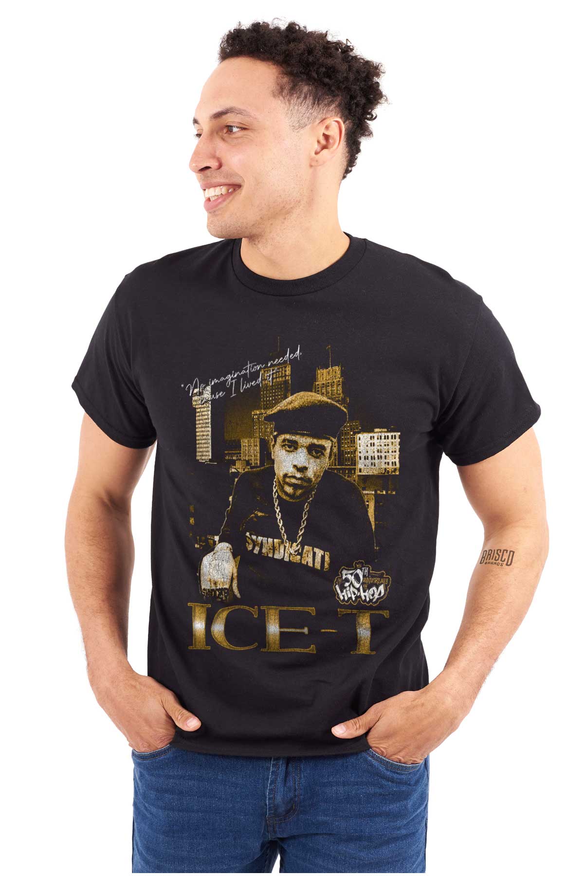 The image shows a confident ICE-T wearing chains in front of city skyscrapers, representing the bold and resilient essence of hip-hop and its legacy.