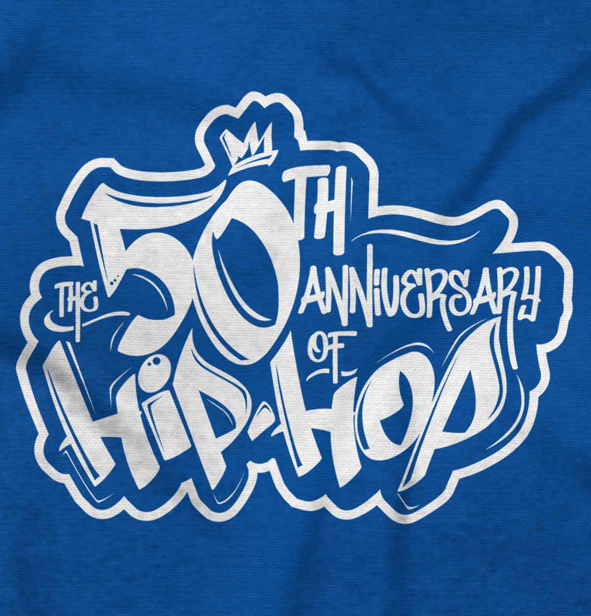 This shirt features a design inspired by urban art with a DJ mixing music and speakers playing. It's a celebration of 50 years of hip-hop and pays homage to its roots.