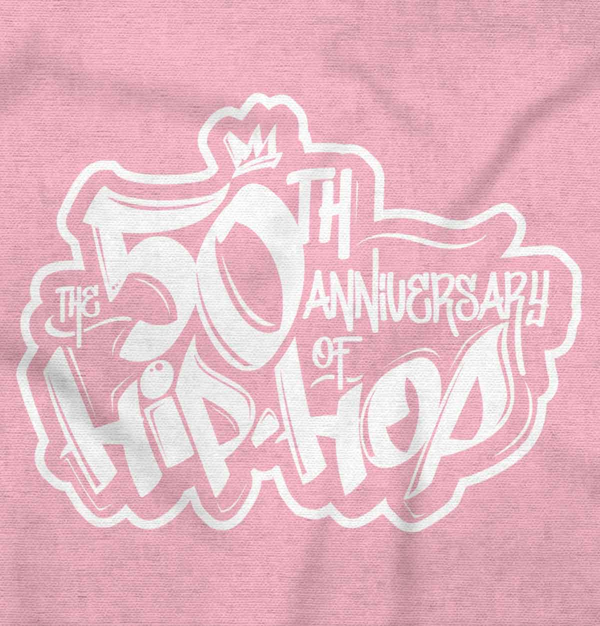 This streetwear design pays homage to influential female hip hop artists, with a graffiti-style logo of a crown in bold pink and white colors, symbolizing their confidence and vibrant energy.