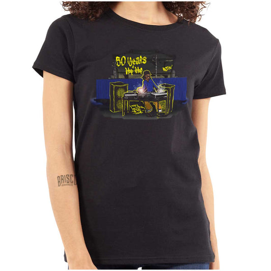 This shirt features a design inspired by urban art with a DJ mixing music and speakers playing. It's a celebration of 50 years of hip-hop and pays homage to its roots.